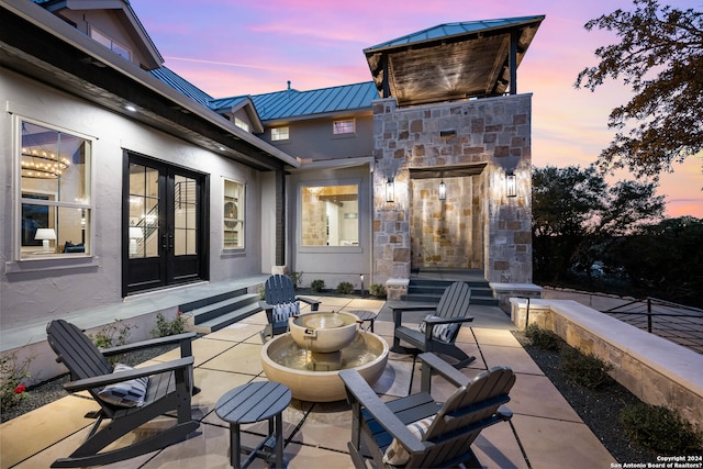 view of patio terrace at dusk