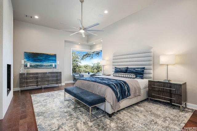 bedroom featuring ceiling fan and dark hardwood / wood-style flooring