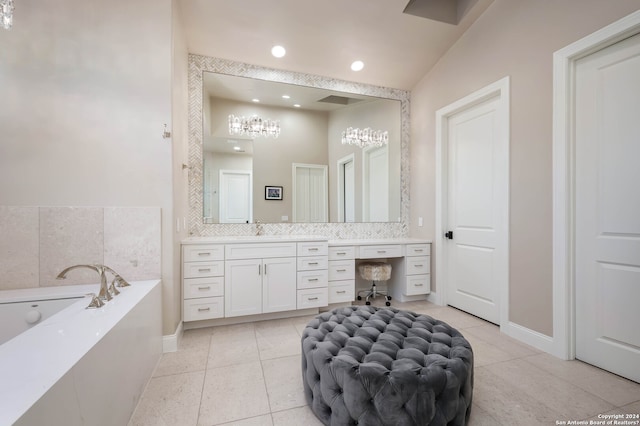 bathroom with vanity, tile patterned floors, and a bath