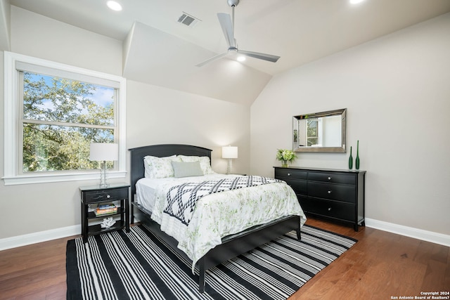 bedroom with ceiling fan and dark hardwood / wood-style flooring