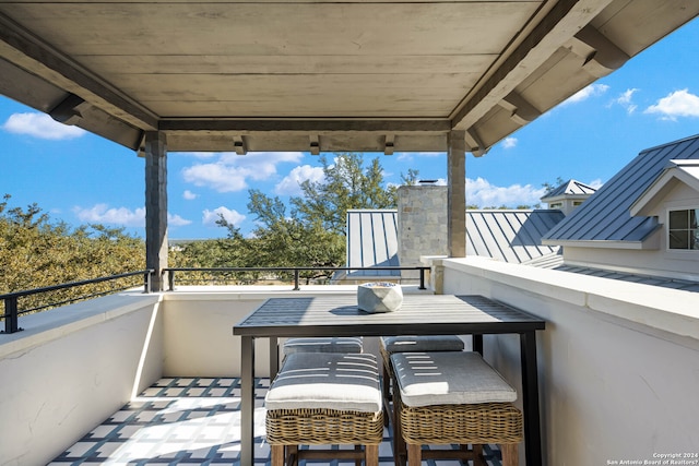 view of patio featuring a balcony