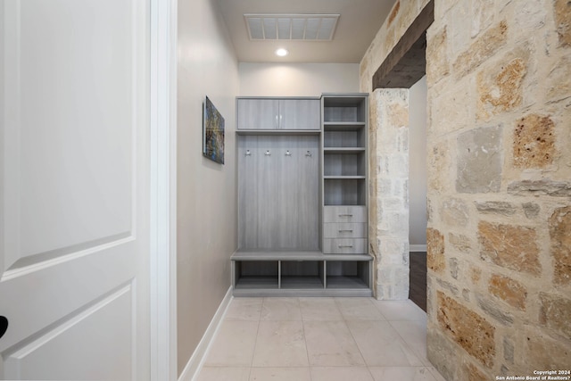 mudroom with light tile patterned floors