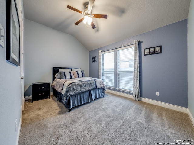 carpeted bedroom featuring ceiling fan and lofted ceiling