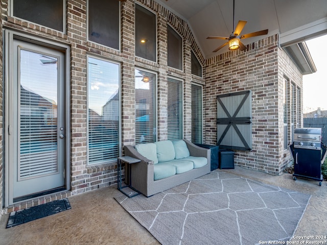 view of terrace with a grill and ceiling fan