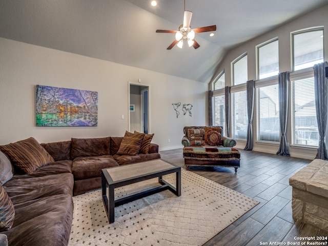 living room featuring light hardwood / wood-style flooring, ceiling fan, and lofted ceiling