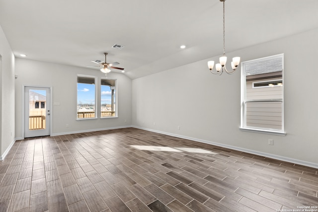 interior space with lofted ceiling and ceiling fan with notable chandelier