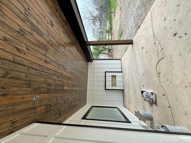 interior space featuring wood walls