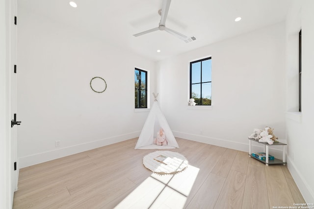 unfurnished room featuring ceiling fan and light wood-type flooring