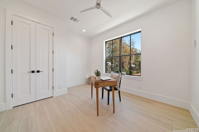 interior space featuring light hardwood / wood-style floors and ceiling fan