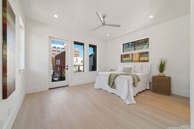 bedroom featuring ceiling fan, access to outside, and light wood-type flooring