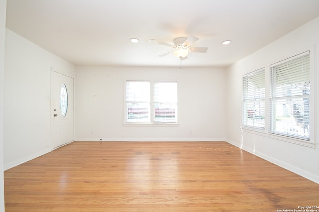 empty room featuring light hardwood / wood-style flooring and ceiling fan