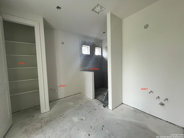 bathroom with concrete floors