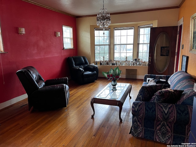 living room featuring light hardwood / wood-style flooring, a wealth of natural light, and a chandelier