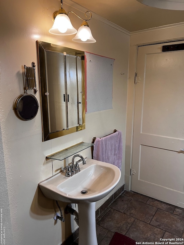 bathroom featuring tile flooring and ornamental molding