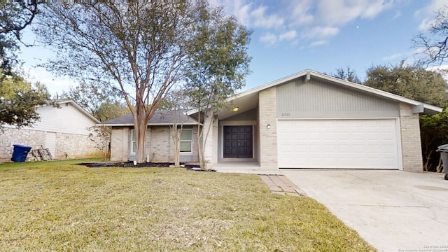 single story home featuring a front lawn and a garage