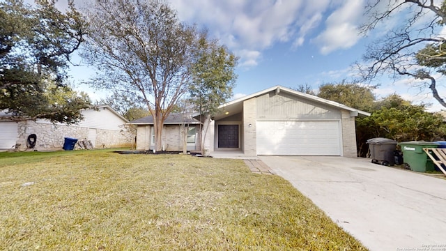 ranch-style home featuring a front lawn and a garage