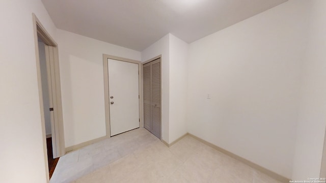 hallway with light tile flooring