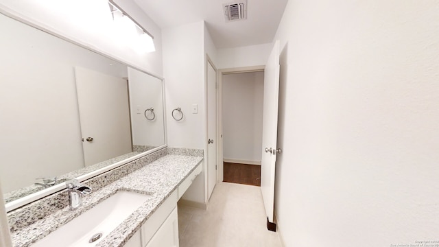 bathroom featuring vanity and tile flooring