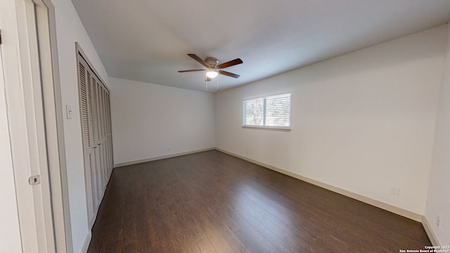 unfurnished room with ceiling fan and dark hardwood / wood-style floors