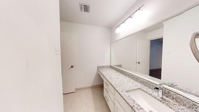 bathroom with vanity with extensive cabinet space