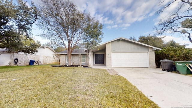 ranch-style home featuring a front lawn and a garage