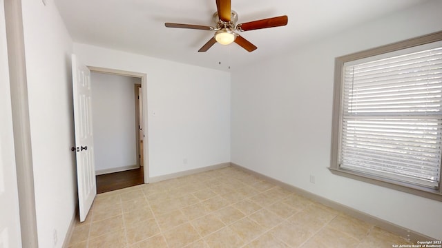 unfurnished bedroom featuring ceiling fan and light tile floors