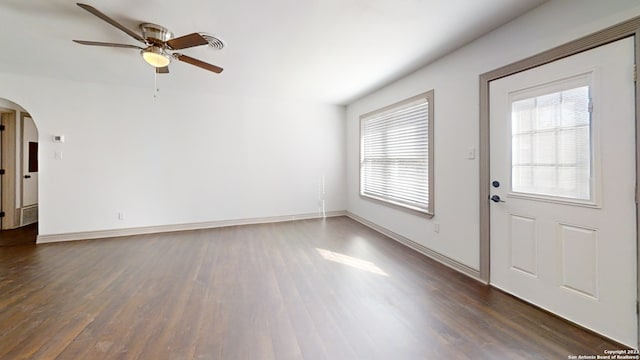 interior space with ceiling fan and dark hardwood / wood-style floors