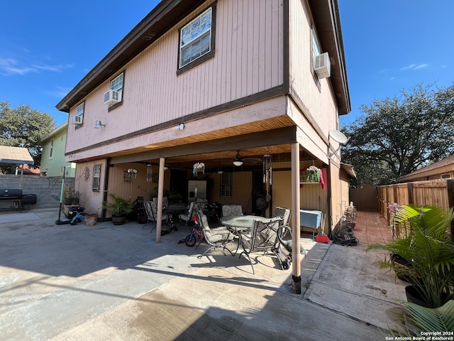 back of house with a patio