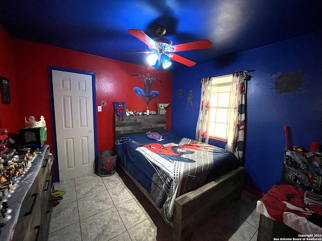 bedroom featuring light tile floors and ceiling fan