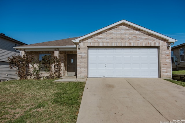 ranch-style house featuring a front lawn and a garage