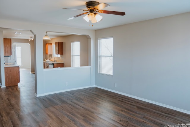 interior space featuring ceiling fan and dark hardwood / wood-style floors