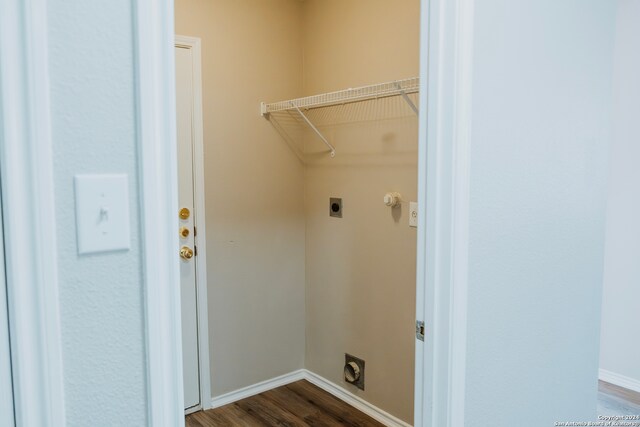 laundry room with dark hardwood / wood-style flooring and electric dryer hookup