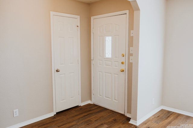 foyer with dark hardwood / wood-style floors