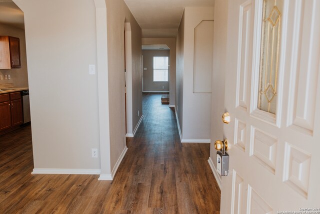 corridor with dark wood-type flooring