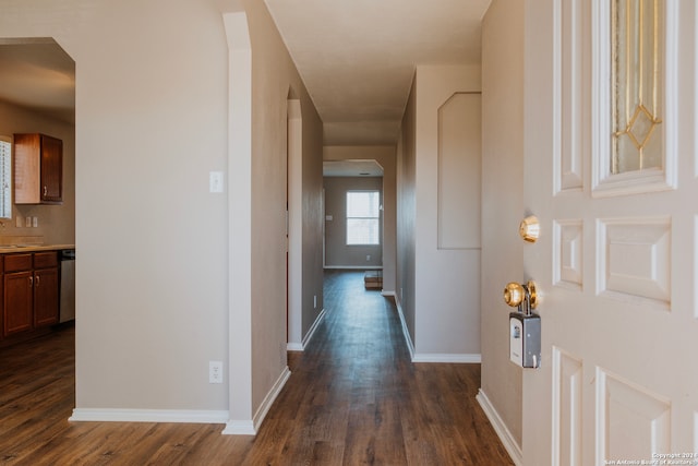 hallway featuring dark hardwood / wood-style flooring