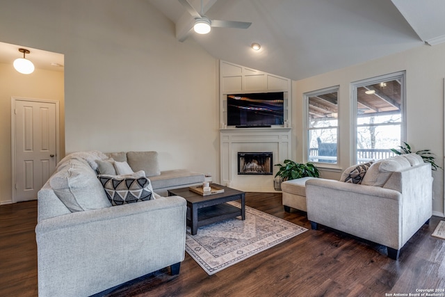 living room with dark hardwood / wood-style flooring, ceiling fan, and lofted ceiling