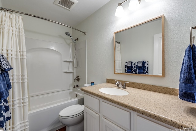 full bathroom with vanity with extensive cabinet space, toilet, and shower / bathtub combination with curtain