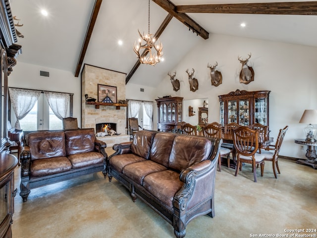 living room with an inviting chandelier, beamed ceiling, a fireplace, high vaulted ceiling, and french doors