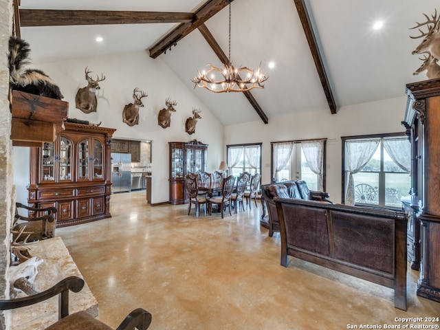 living room featuring an inviting chandelier, beam ceiling, and high vaulted ceiling