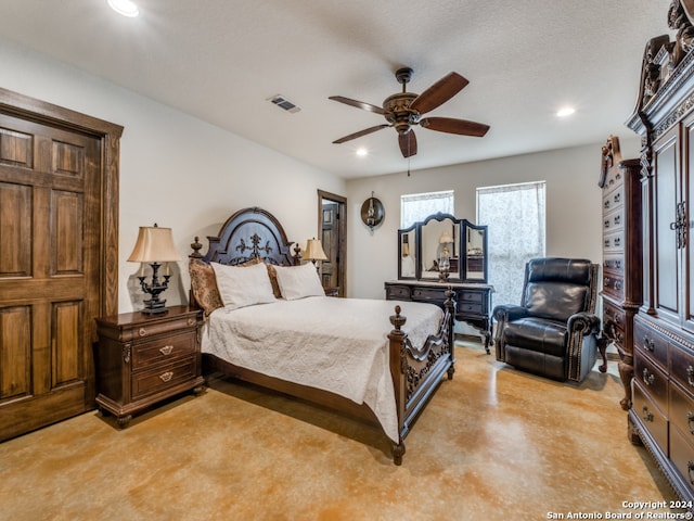 bedroom featuring ceiling fan and a textured ceiling