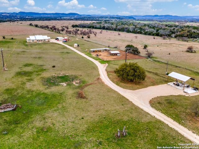 bird's eye view featuring a rural view and a mountain view