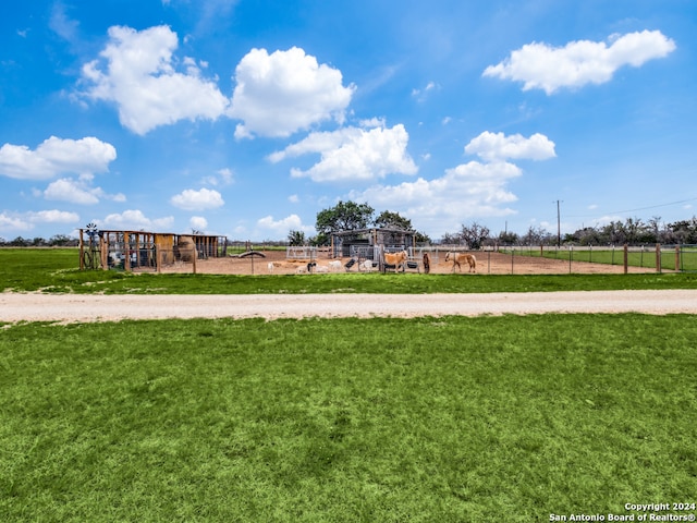 view of property's community with a yard