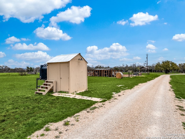 view of shed / structure featuring a yard