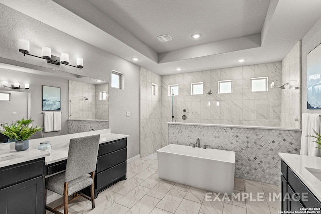 bathroom with vanity, tile flooring, a textured ceiling, and tile walls