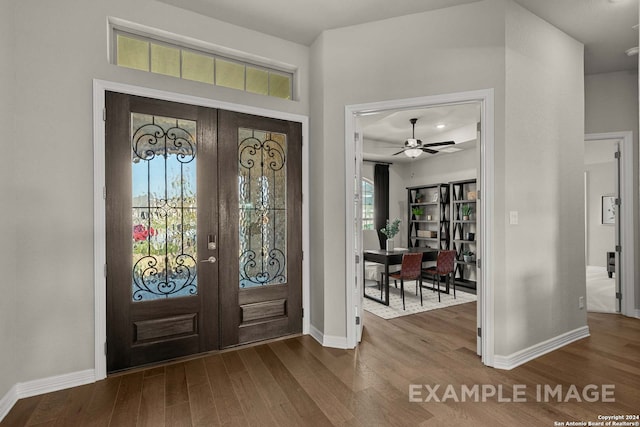 entrance foyer with ceiling fan, french doors, and dark hardwood / wood-style flooring