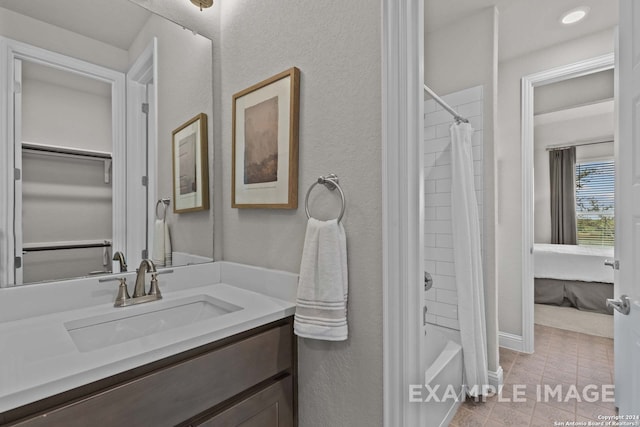 bathroom featuring vanity, tile floors, and shower / bath combo