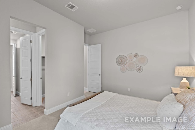 bedroom featuring light colored carpet