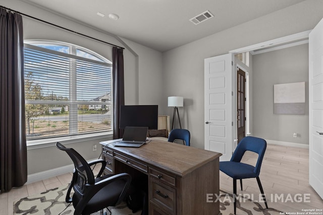 office featuring plenty of natural light and light wood-type flooring