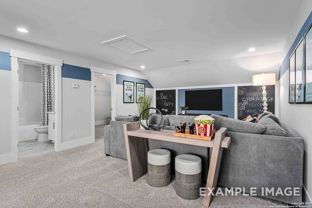 living room featuring light carpet and vaulted ceiling