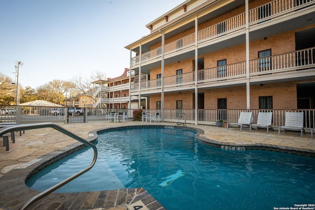 view of swimming pool with a patio area